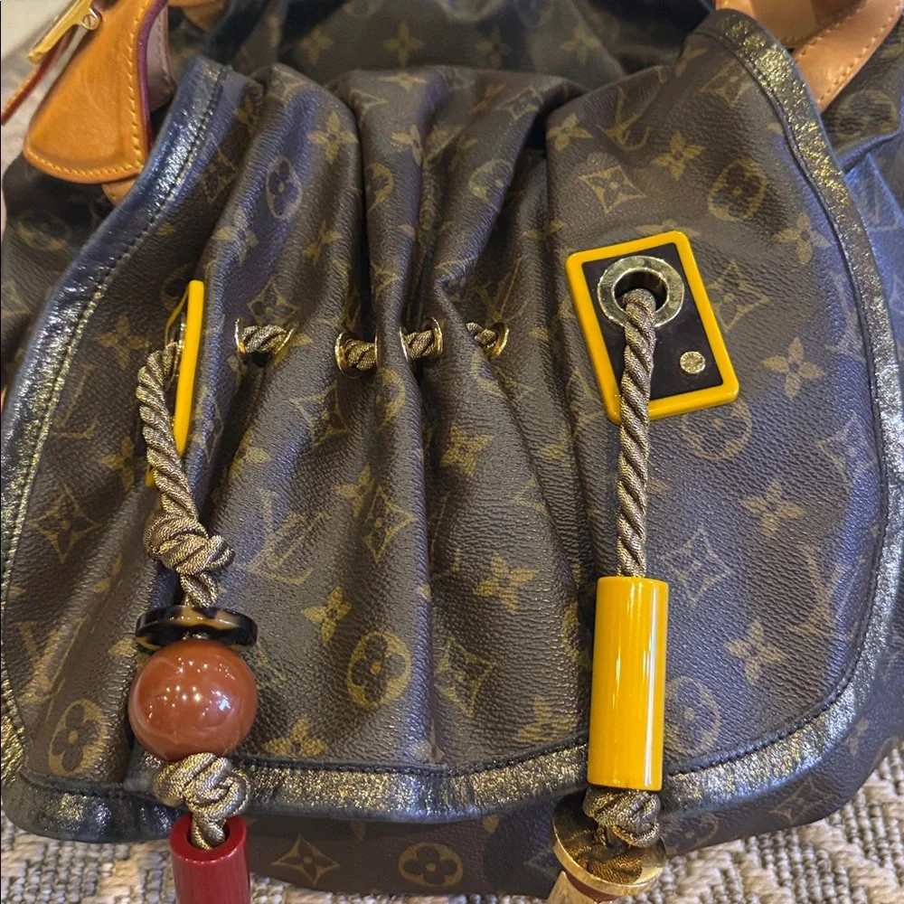 Louis Vuitton Brown Monogram Drawstring Shoulder Bag circa 2009